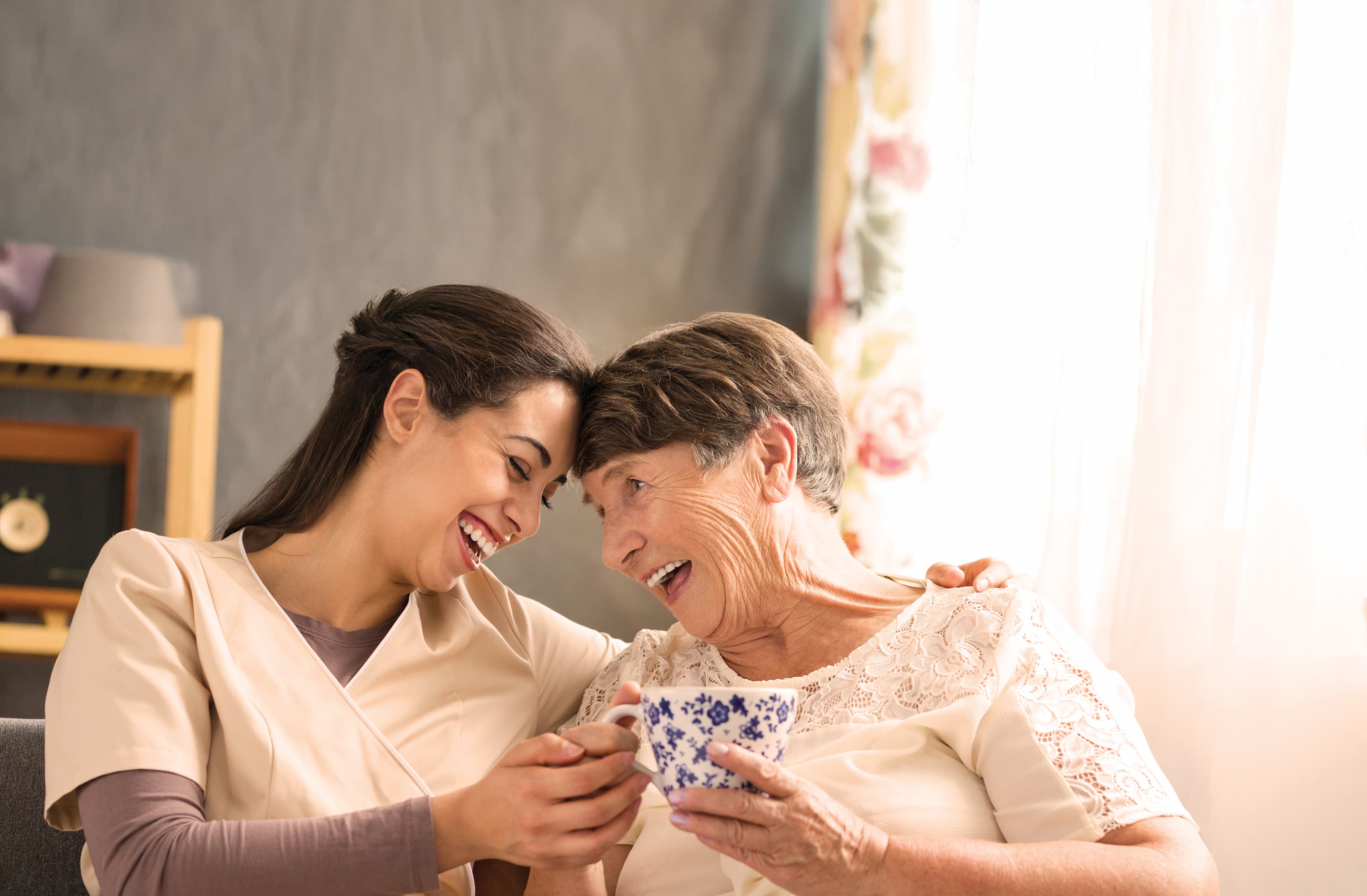 Caregiver with resident at The Neighborhood